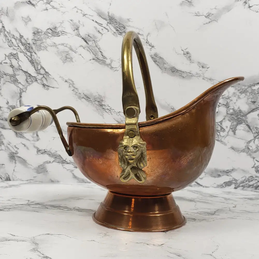 Vintage brass small bucket with handle and ornate candle holder.